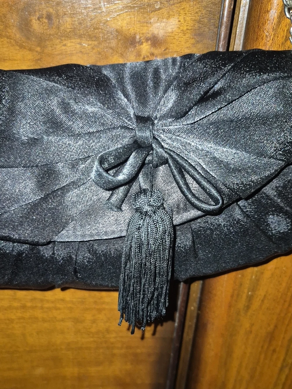Vintage: A black satin foldover evening bag. Satin Bow& Rusch Pleating &tassels